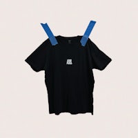 a black t - shirt with blue tape on it